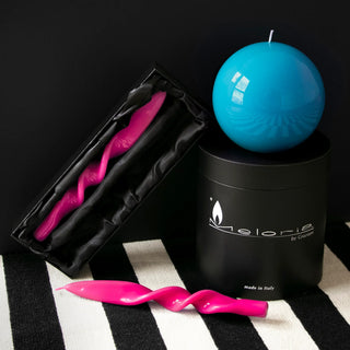 Turquoise Meloria sphere candle and pink twisted candle with black gift packaging